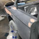 Freshly sanded, straight bodywork ready for painting in the carport paint booth.